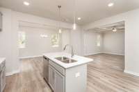 Great View of this defined Open Concet layout with the Kitchen as the heart of the home, open to the Formal Dining (left) and Living Room (Right)