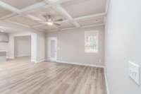 Living Room open to Kitchen overlooking the Covered Back Porch