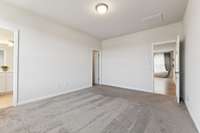 This view of the Owner's Suite captures Bath, Walk-in Closet and entryway.