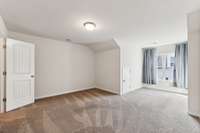 On the third floor upstairs, you will find this large bedroom, walk-in closet and door to floored storage!  Oh!  Let's not forget the Full Bath, too!