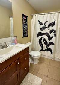 full bathroom inside upper level bedroom
