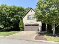End unit with nice privacy and trees next to you.