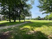 This little area is perfect to simply sit in the shade and enjoy the view, a good book or talking with a neighbor!  There are a couple of these areas - so very nice and quaint.