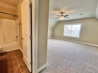 Shows access to the full bath upstairs.