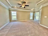 Primary bedroom suite on the main level is very spacious!  Bring your king sized bed - there's plenty of space!