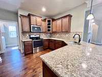 Nice neutral colors - Granite countertops - the laundry room is off of the kitchen with a window.