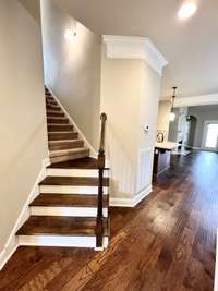 The main level has 2 BR, 2 BA and the stairway leads to 2 additional BRs and a full bath.  Beautiful hardwood flooring and hardwood steps!