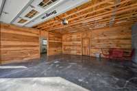 Storage area at the the back of garage also hides utilities.