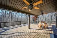 Covered deck on the main level is easily accessed via the living room. Great for entertainment or a quiet cup of coffee in the morning.