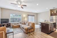 This open-concept design fosters excellent communication between the kitchen and living room, offering ample space for gatherings and relaxation.