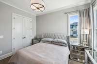 Bedroom Two is an ideal guest suite, conveniently located on the main level for privacy and ease. Notable features include hardwood flooring, a walk-in closet, and direct access to a full bath.