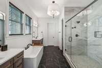 Your retreat continues into the well-appointed primary bath, designed for both luxury and functionality.