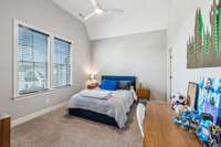 Bedroom Three offers plush carpeting, a private bath, walk-in closet, and a charming hideaway—perfect for storing toys or creating a cozy gaming nook.