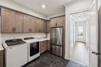 A spacious counter area makes folding a breeze. As an added bonus, a second refrigerator space provides extra storage for groceries and beverages.