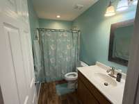 Apartment bathroom, with handicap accessibility.