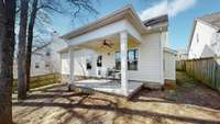 Sip your morning coffee on this peaceful covered porch in the back!