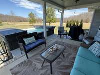 Covered back porch with swim spa
