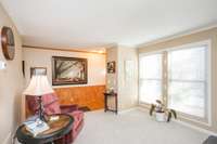 The living room is 16'10" by 12'7"... a great size for all kinds of furniture layouts.