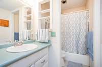 The bedrooms share a bathroom that has a combination tub/shower.