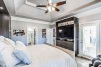 escape from your primary suite to the covered porch for morning coffee or a night cap