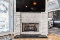 stacked stone fireplace adds drama to this space