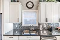 glass tile black spalsh pulls the look together! Clean and classic
