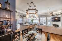 Designated dining area helps the entertaining space to remain open but can accommodate a large table for the whole family and all of your guests!