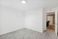 Main floor bonus living area backing up to the 5th bedroom option. Has a separate entrance to the back deck.