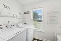 Laundry room with 2 year old washer and dryer.