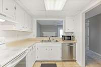 Kitchen featuring 2 year old dishwasher and refrigerator.