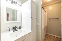 Main level owners suite bathroom recently remodeled. Crisp & Clean!