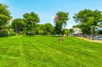 Huge back yard. Very serene & beautifully landscaped. The yard also has invisible dog fence  that circles around front & back along with two dog collars.  Be sure to watch the VIDEO on the main page under Document s & Links...
