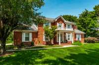 Classic all brick two story home. Level manicured yard with beautiful shade trees.