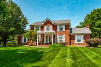 Home sets back off the road close to the middle of it's 1.12 acre lot. Surrounded by lush green grass in both the front and back yard. The front yard has irrigation & the back yard has partial irrigation.