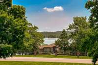 Looking at the lake from the front yard. A clear view right over the neighbors rooftop.