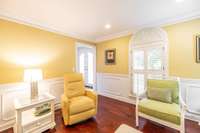 The parlor also has recessed lighting crown moldings, detailed chair rail, & a terrific view of the front yard.
