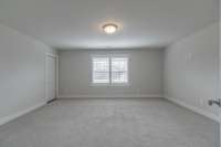 Second upstairs bedroom with a very large walk-in closet.