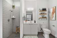 The large walk-on shower is amazing!!! Tile floors are found throughout the bath area.