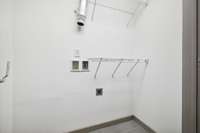 Can accommodate full size washer & dryer.