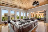 Double Anderson accordion doors reveal the penthouse’s secret garden. A 700-square-foot ipe deck offers private outdoor space, ample seating, and alfresco dining.