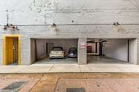 A two-bay, four-car garage with a lift rounds out the comprehensive offering, adding residential convenience to this city estate.
