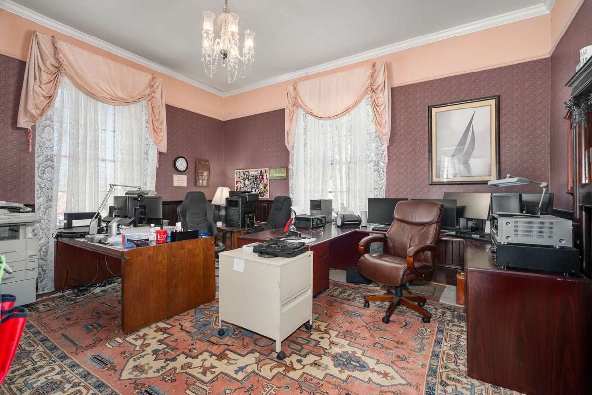 Front room, currently used as an office space.
