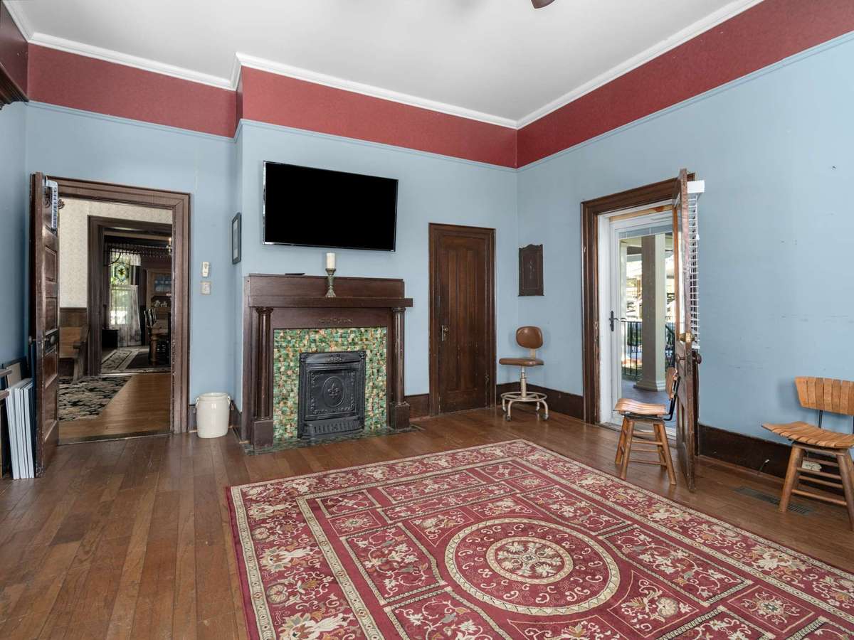 Original tiled fireplace - chimneys are sealed, therefore fireplaces are currently non-functioning.