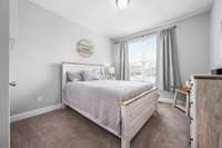 Guest room with large walk-in closet on main level