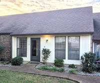 Charming 2-bed, 2-bath condo with vaulted ceilings, private patio, loft, garage, and low-maintenance living in peaceful Deer Park, minutes from major interstates.