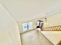 View from the Loft overlooking the Living Room/Dining Area. Great open floor plan