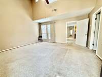 14x16 Primary Suite has lots of natural lighting with skylight and multiple windows; carpet floor covering; Full Bath has tub/shower combo with oak vanity double cultured marble sinks & vinyl flooring