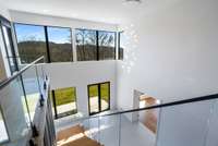 Two story reception as viewed from the top of the stairs a preview of the hillside vista