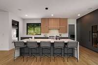 The kitchen is modern and minimal but is packed with features and function.