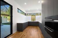 The pantry features patio access and a third oven as well as a warming drawer and a speed-cook oven.